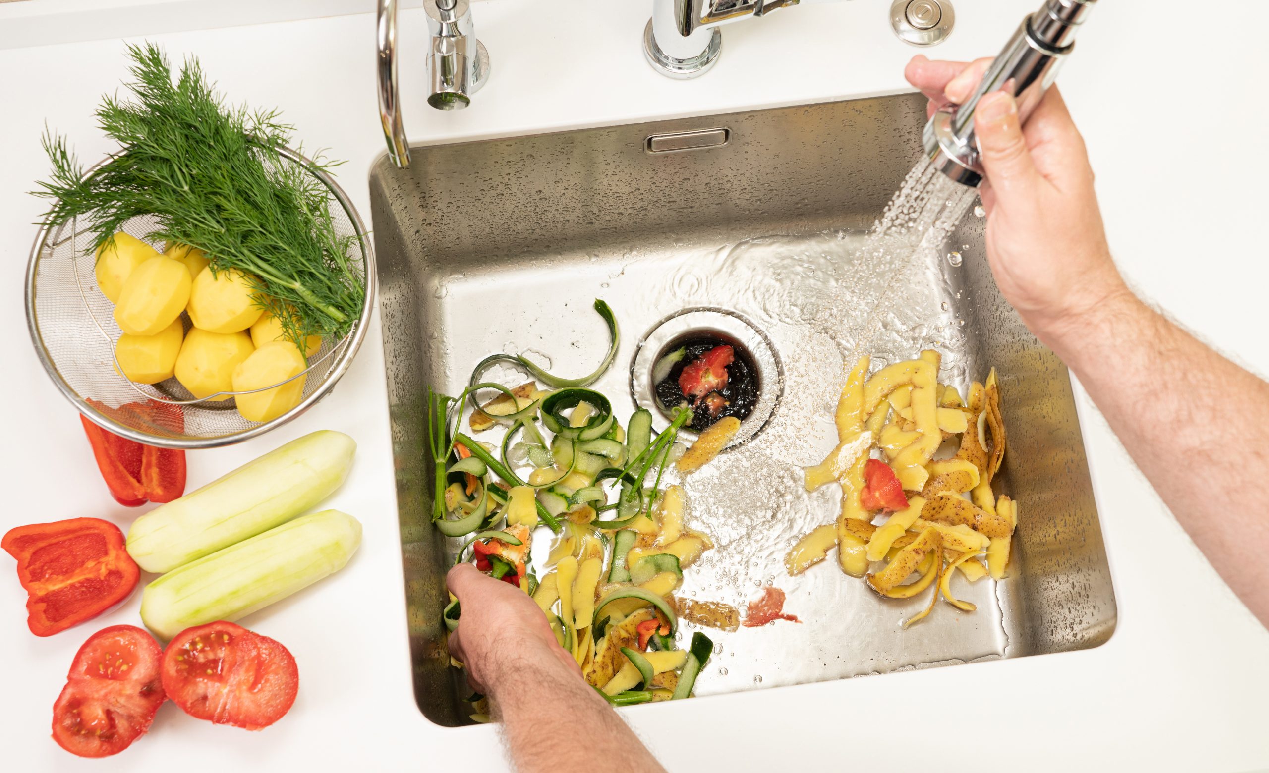 Why Your Garbage Disposal Has a Reset Button and What It Actually Does