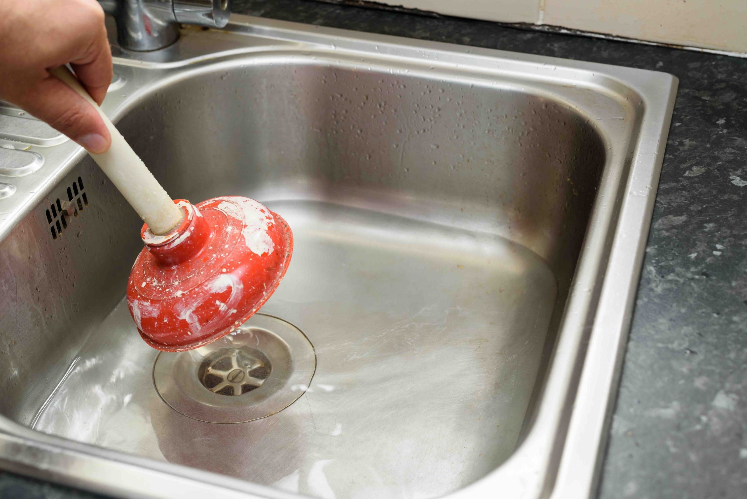 Unclogging a Kitchen Sink With a Disposal: Full Guide
